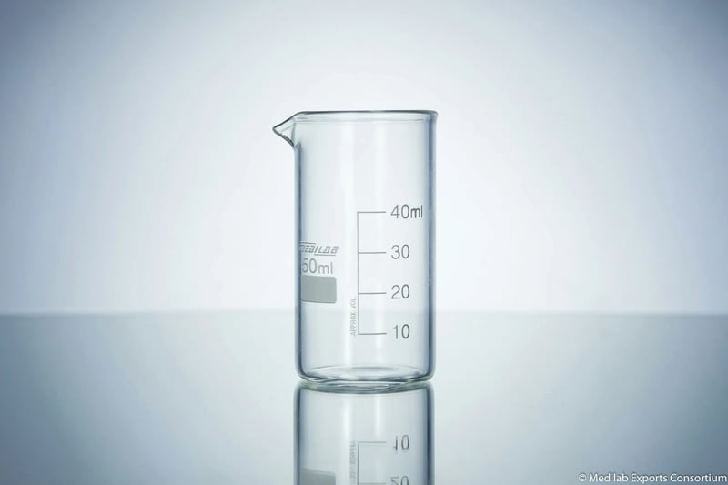 Laboratory beakers representing the science behind EtG testing