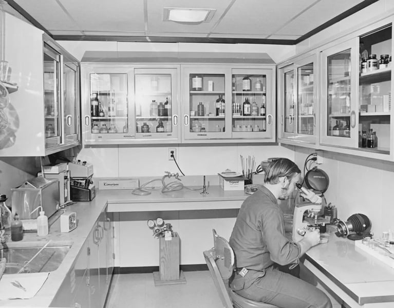 Scientist working with analytical instruments inside a laboratory